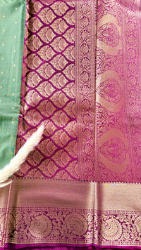 Kanchipuram silk saree featuring a pista green solft silk saree a rich purple and zari women traditional border  (Saree Code - S101)