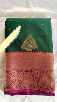 Green and Purple Kanchipuram silk saree features an elegant contract zari border and intricate traditional motifs  (Saree Code - S102)