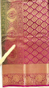 Green and Purple Kanchipuram silk saree features an elegant contract zari border and intricate traditional motifs  (Saree Code - S102)