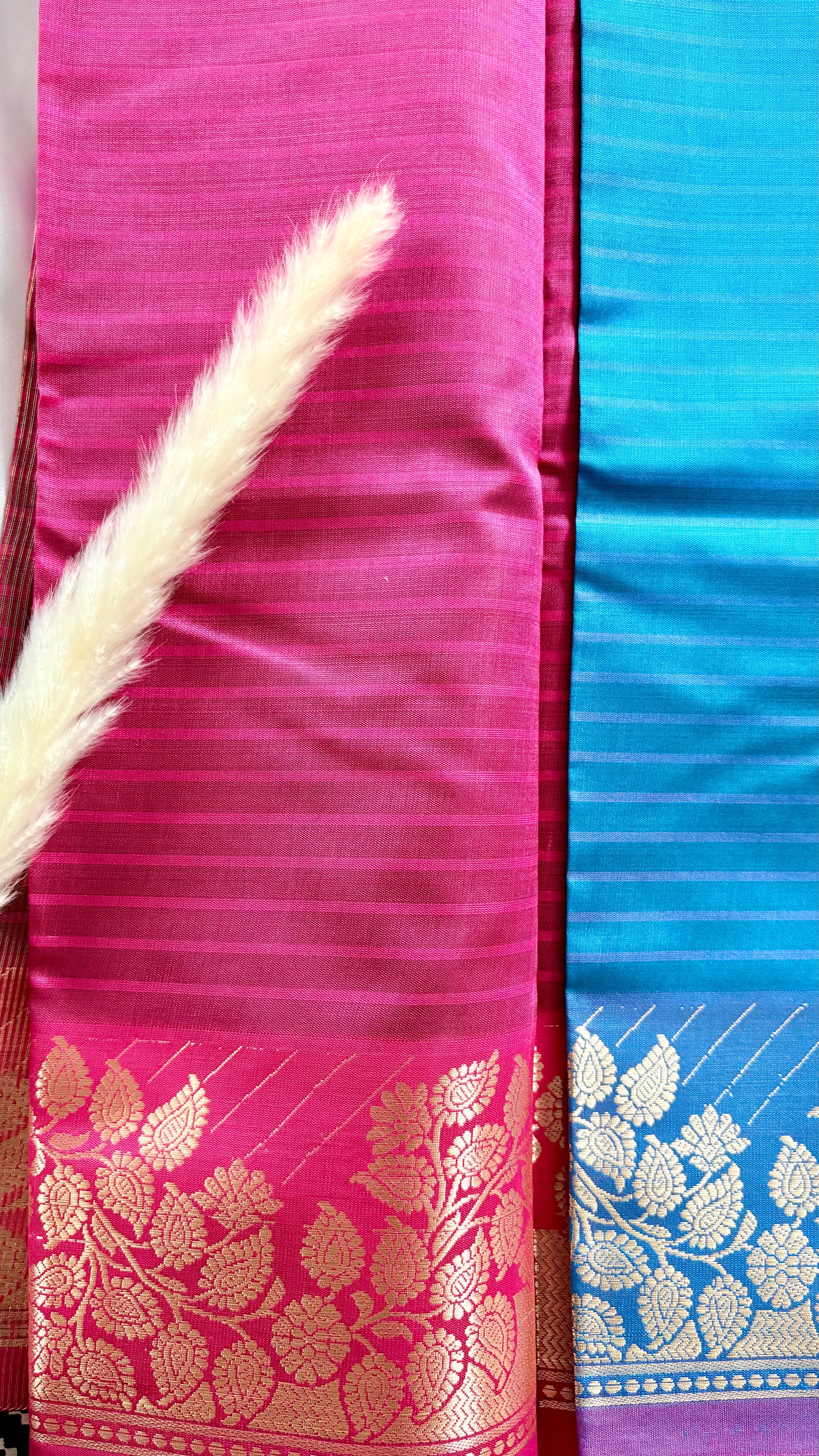 Soft silk saree features a detailed gold zari woven floral border and a subtle horizontal stripes  (Saree Code - S103)