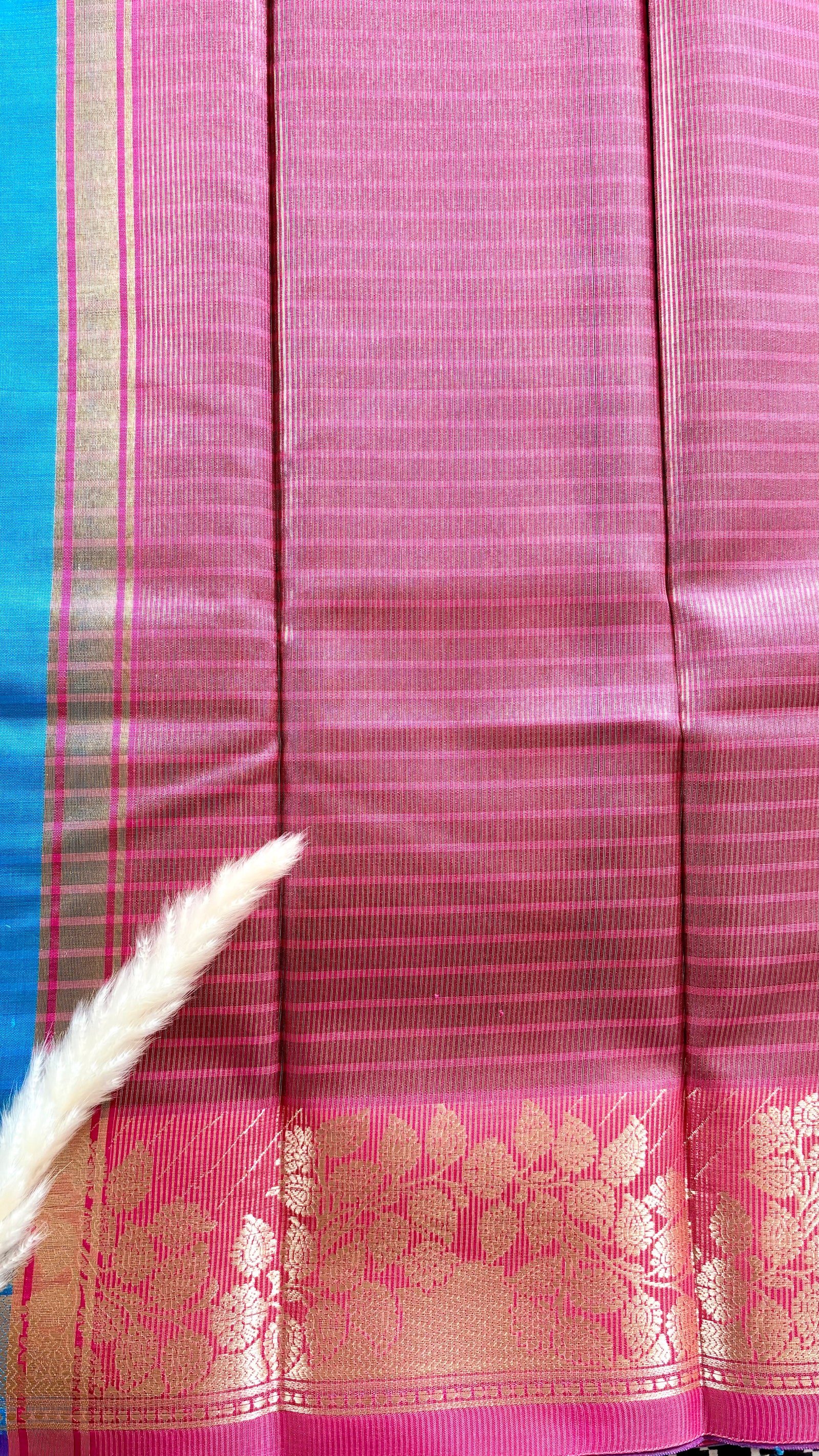 Soft silk saree features a detailed gold zari woven floral border and a subtle horizontal stripes  (Saree Code - S103)