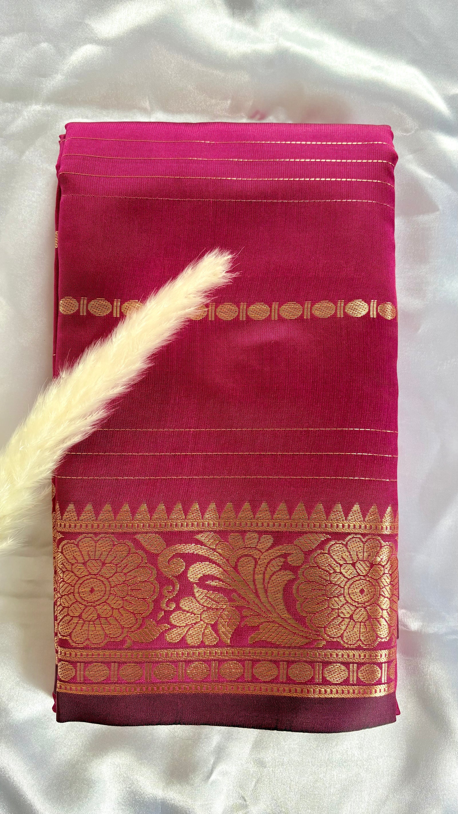 Deep Magenta soft silk saree featuring a traditional golden zari woven floral border and horizontal line accents  (Saree Code - S104)