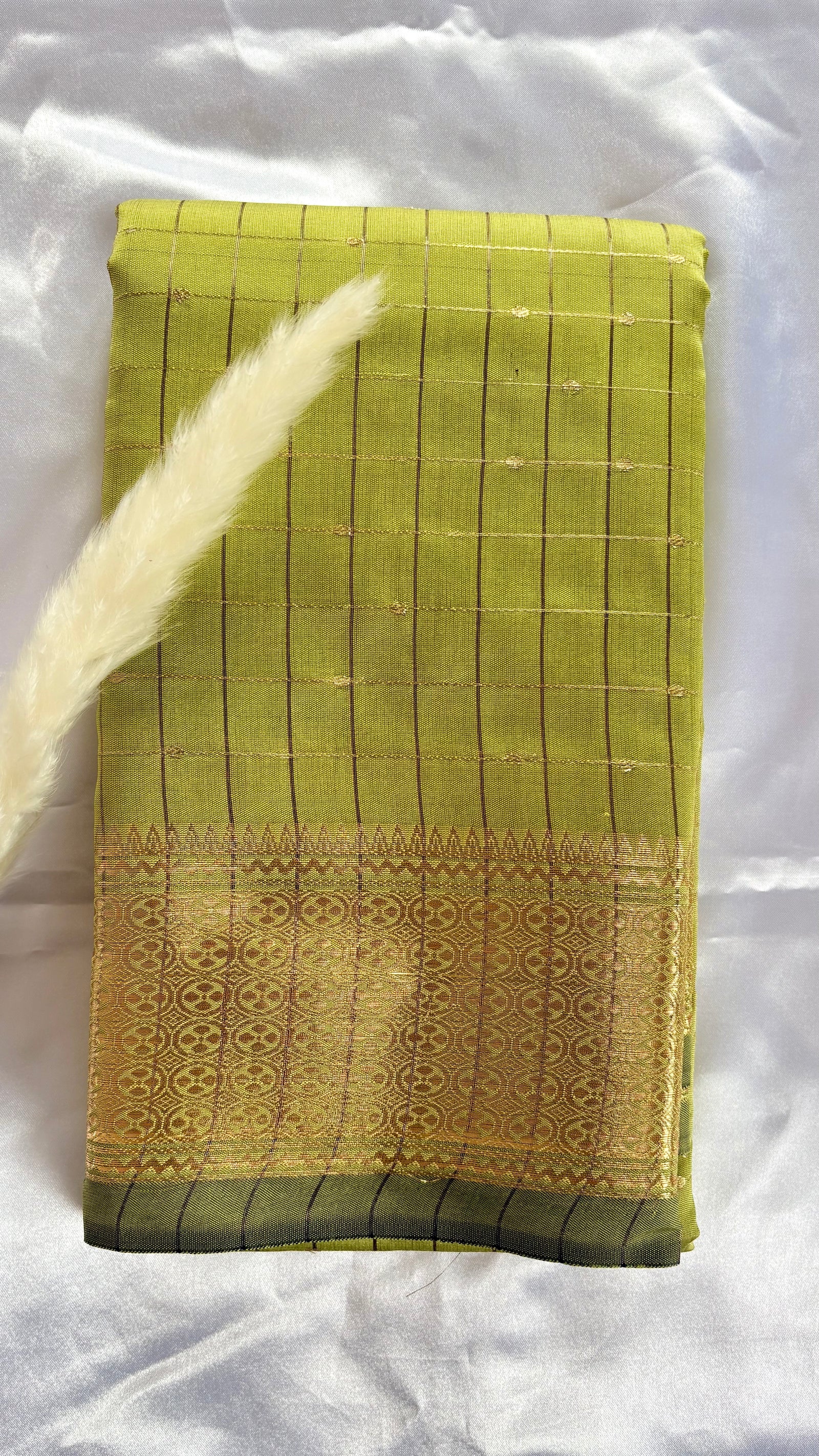 Soft silk canary yellow check pattern complemented by a broad, ornate silver zari woven border  (Saree Code - S105)