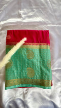 Kanchipuram crepe silk saree features a stricking dural tone contract sea green bidy and a deep maroon-red border  (Saree Code - S106)