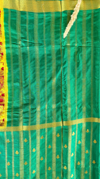 Beutiful yellow and green semi mysore crepe silk saree features vibrant floral and bird kalamkari print paired with a rich gold zari border (Saree Code - S71)