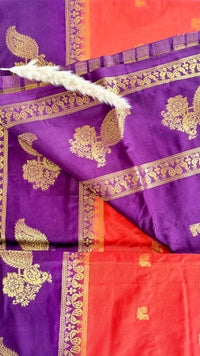 Featuribg an Orange body and a Wine-Coloured Border, Intircately woven with traditional goldern zari motifs (Saree Code - S72)