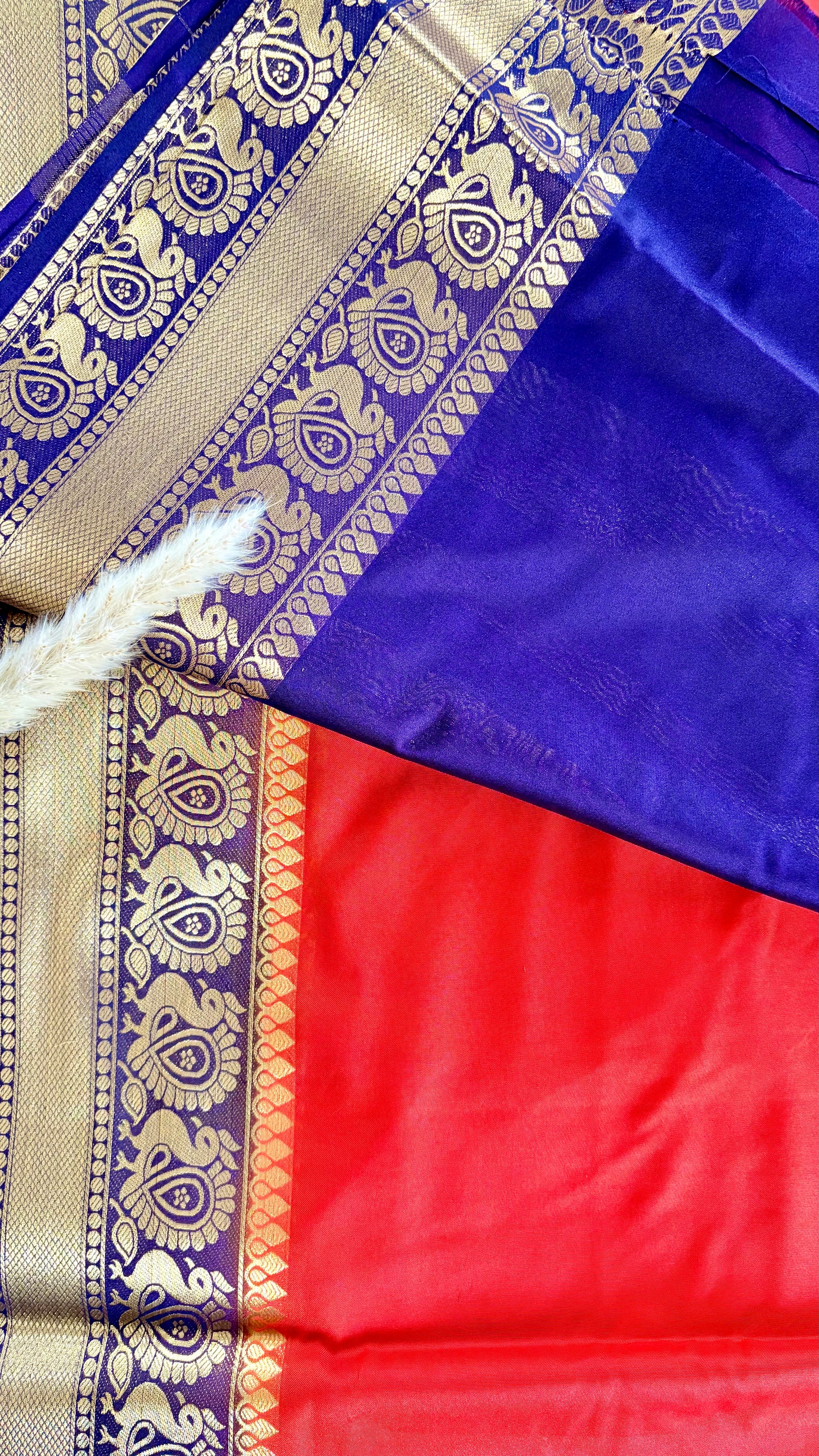 Vibrant Orange silk saree featuring a traditional woven golden zari peacock and floral motif border (Saree Code - S74)