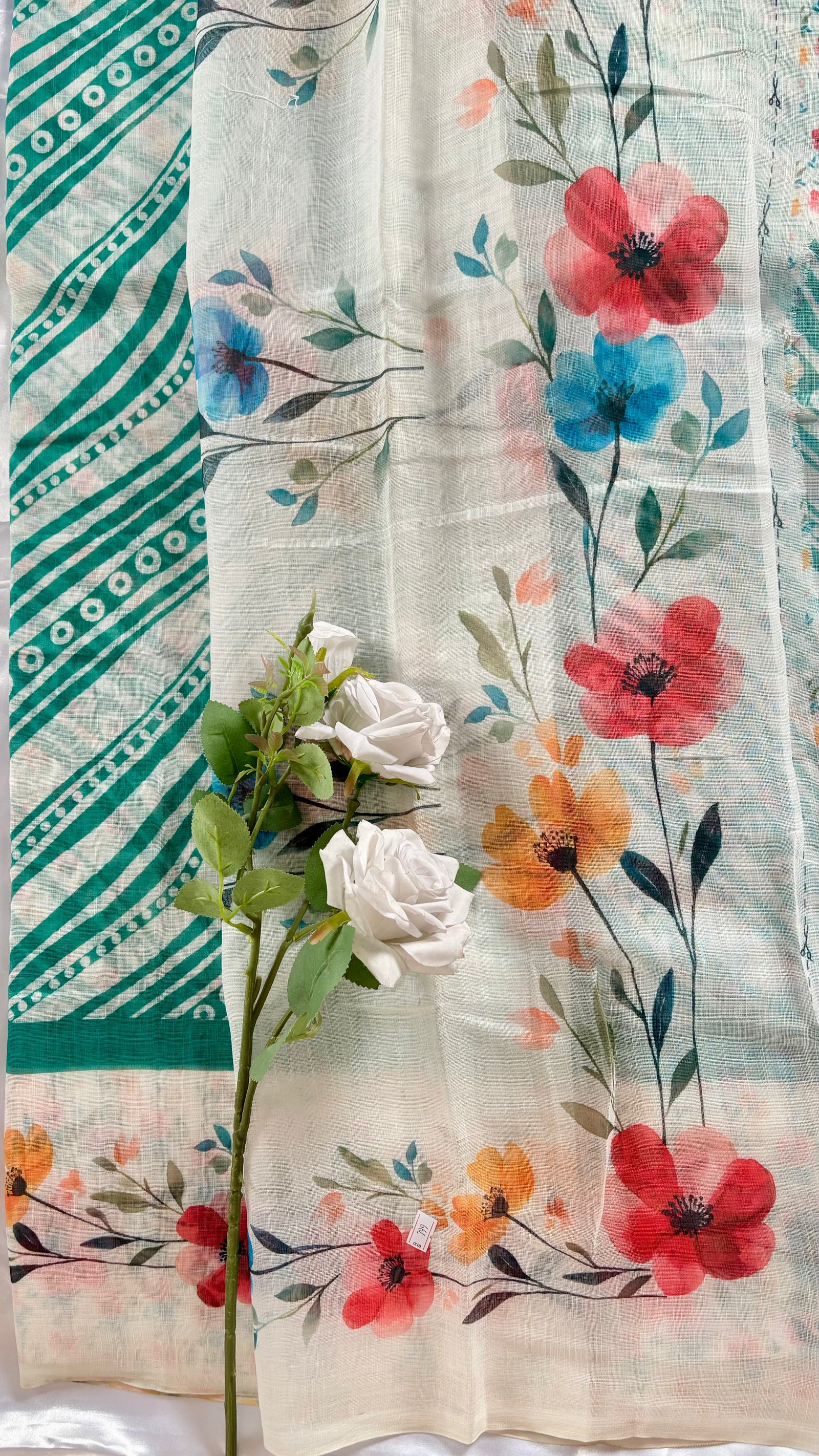 Off-white and green chanderi cotton silk saree featuring a delictae watercolor-style floral stripe across the body and a stripped green border ( (Saree Code - S81)