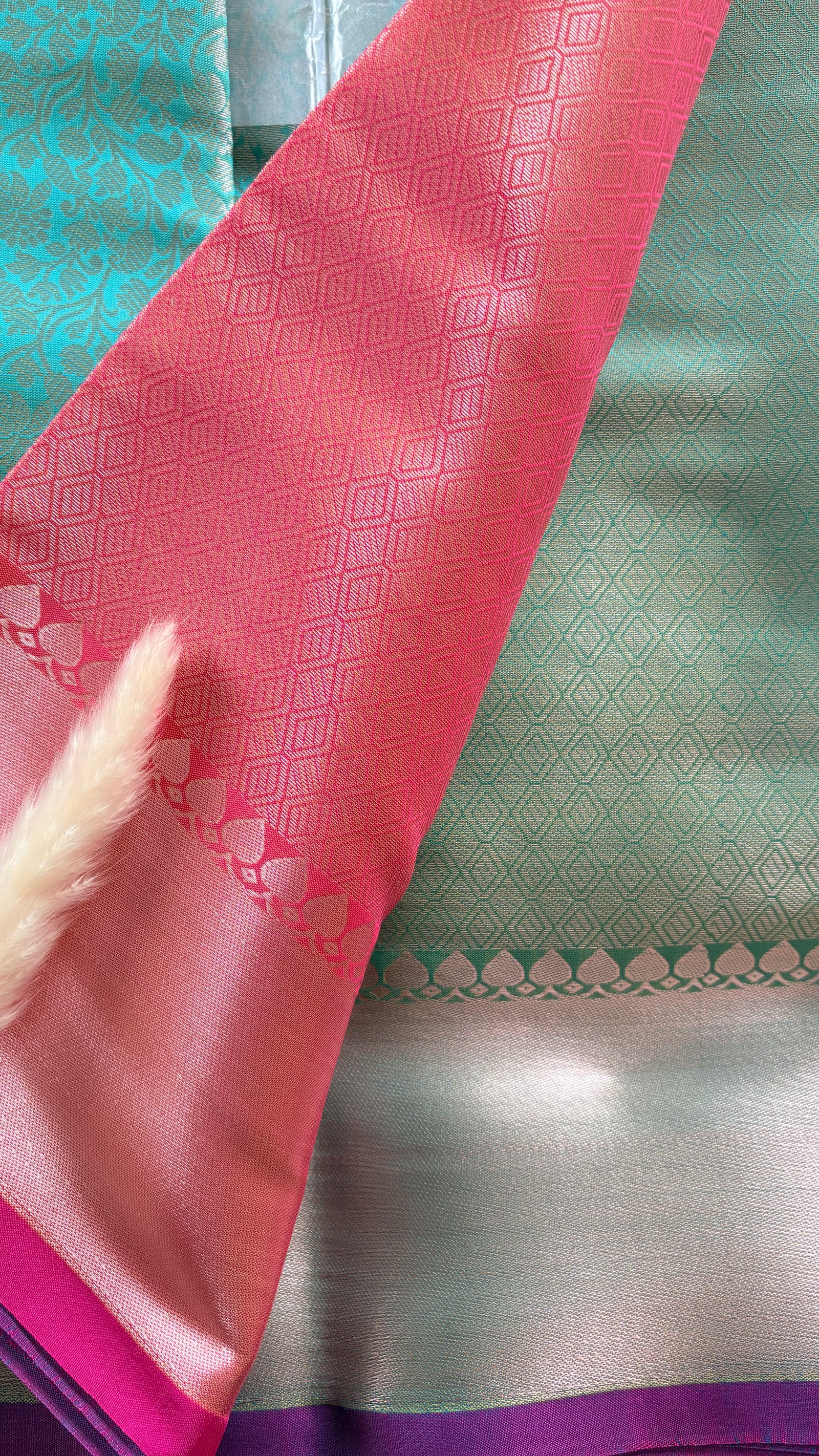Kanchipuran Tissue silk saree featuring an intricate floral sea green body paired with a contract Lavender Zari Border ( (Saree Code - S92)
