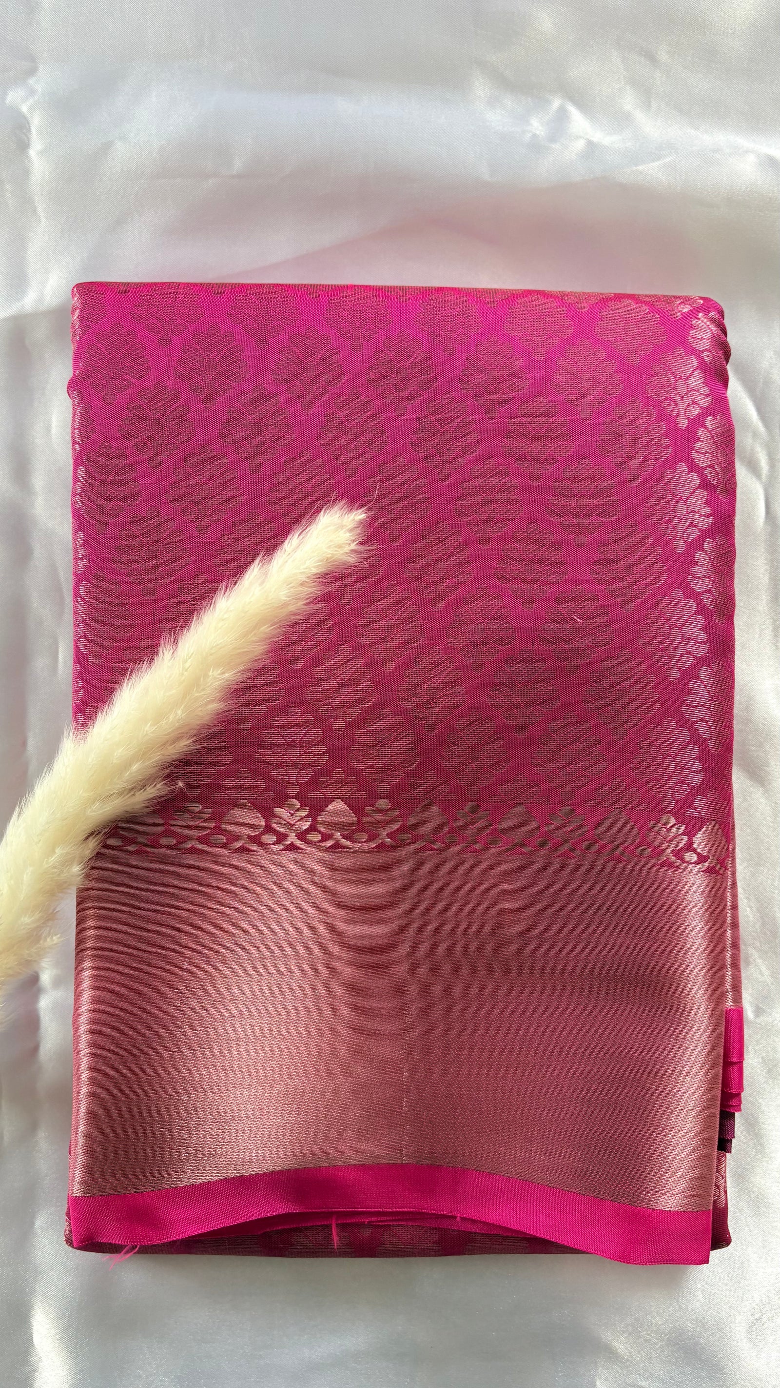 Kanchipuram Tissue Silk Saree in a ruby pink and magenta brocade Zari weaving throughout body and a solid metallic border ( (Saree Code - S93)