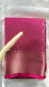 Kanchipuram Tissue Silk Saree in a ruby pink and magenta brocade Zari weaving throughout body and a solid metallic border ( (Saree Code - S93)