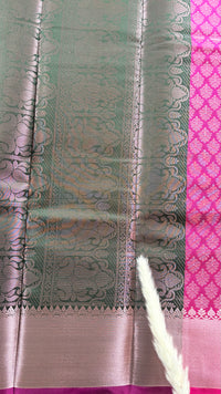 Kanchipuram Tissue Silk Saree in a ruby pink and magenta brocade Zari weaving throughout body and a solid metallic border ( (Saree Code - S93)