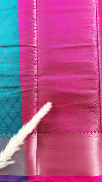 Kanchivarama wide metallic woven gold border and a contrasting purple selvedg Teal Greensilk saree, featuring intricate all-over floral leaf zari motifs and a contract metallic tissue border  (Saree Code - S96)