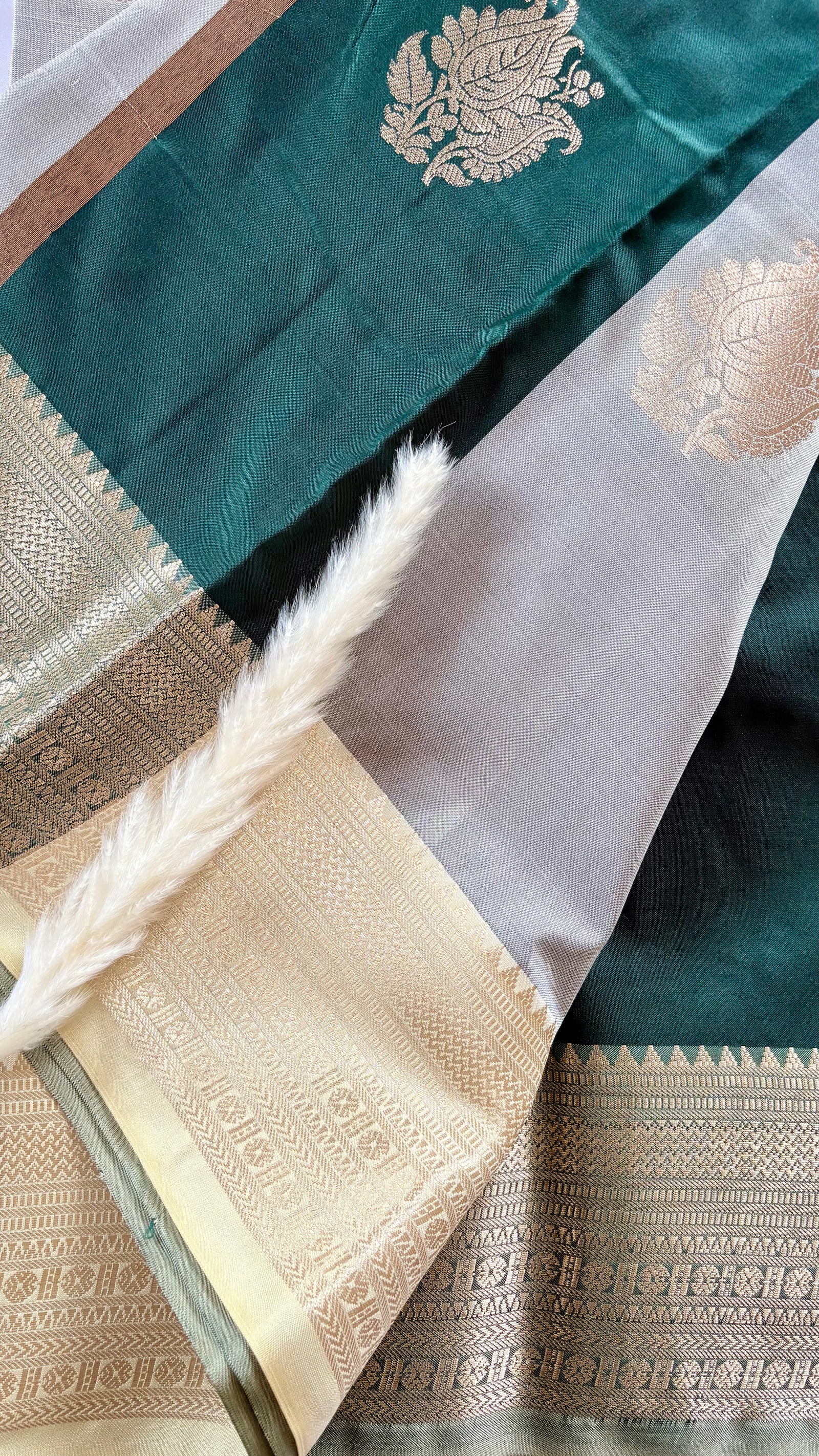 Teal Green Kanchipuram-inspried semi-pattu silk saree, featuring intricate all-over floral leaf zari motifs and a contract metallic tissue border  (Saree Code - S97)