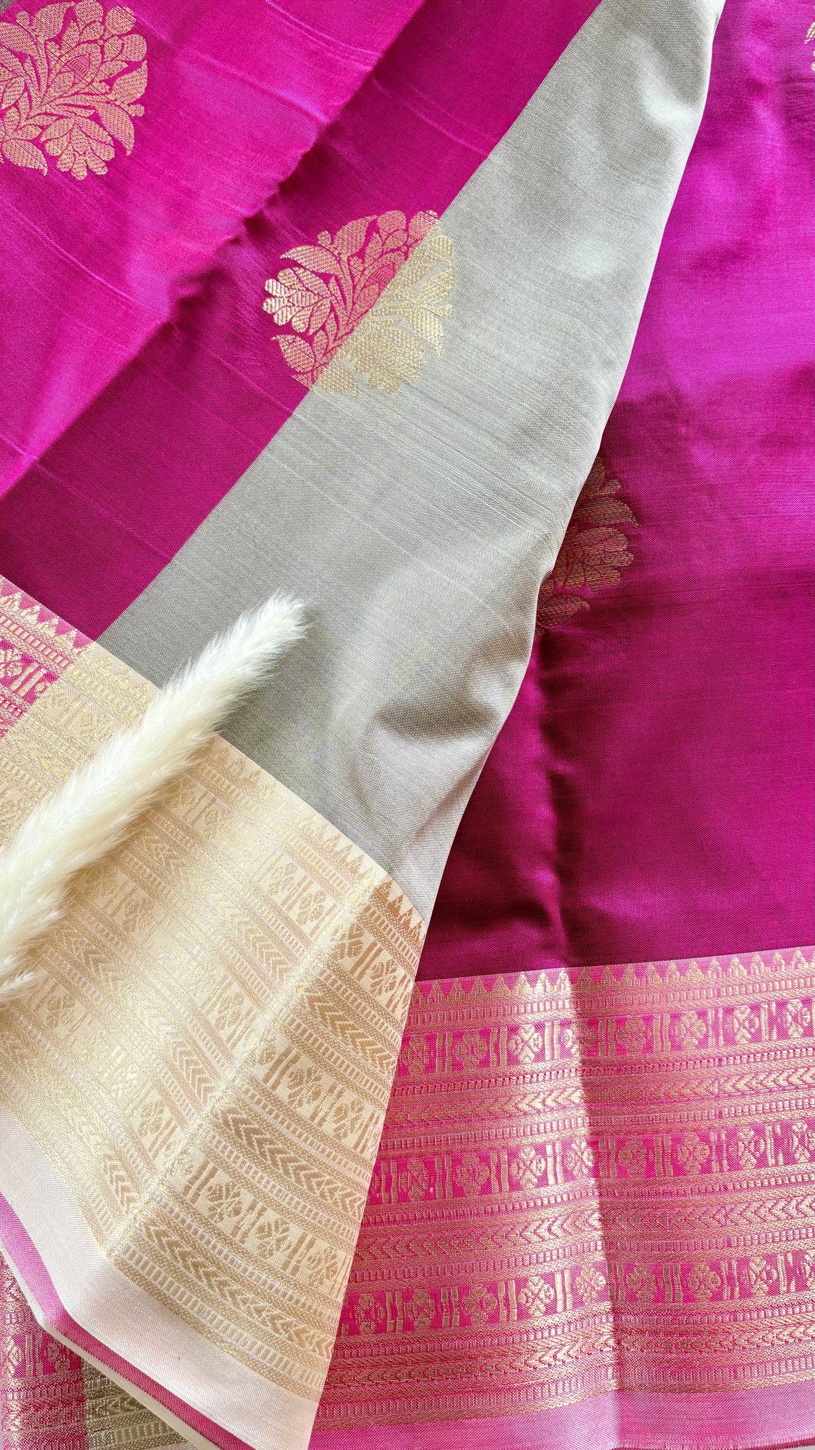 Maroon Kanchipuram soft silk saree adorned with traditional gold zari bootis and an intricate geometric patterned border  (Saree Code - S98)