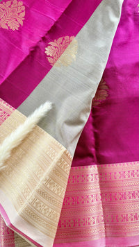 Maroon Kanchipuram soft silk saree adorned with traditional gold zari bootis and an intricate geometric patterned border  (Saree Code - S98)