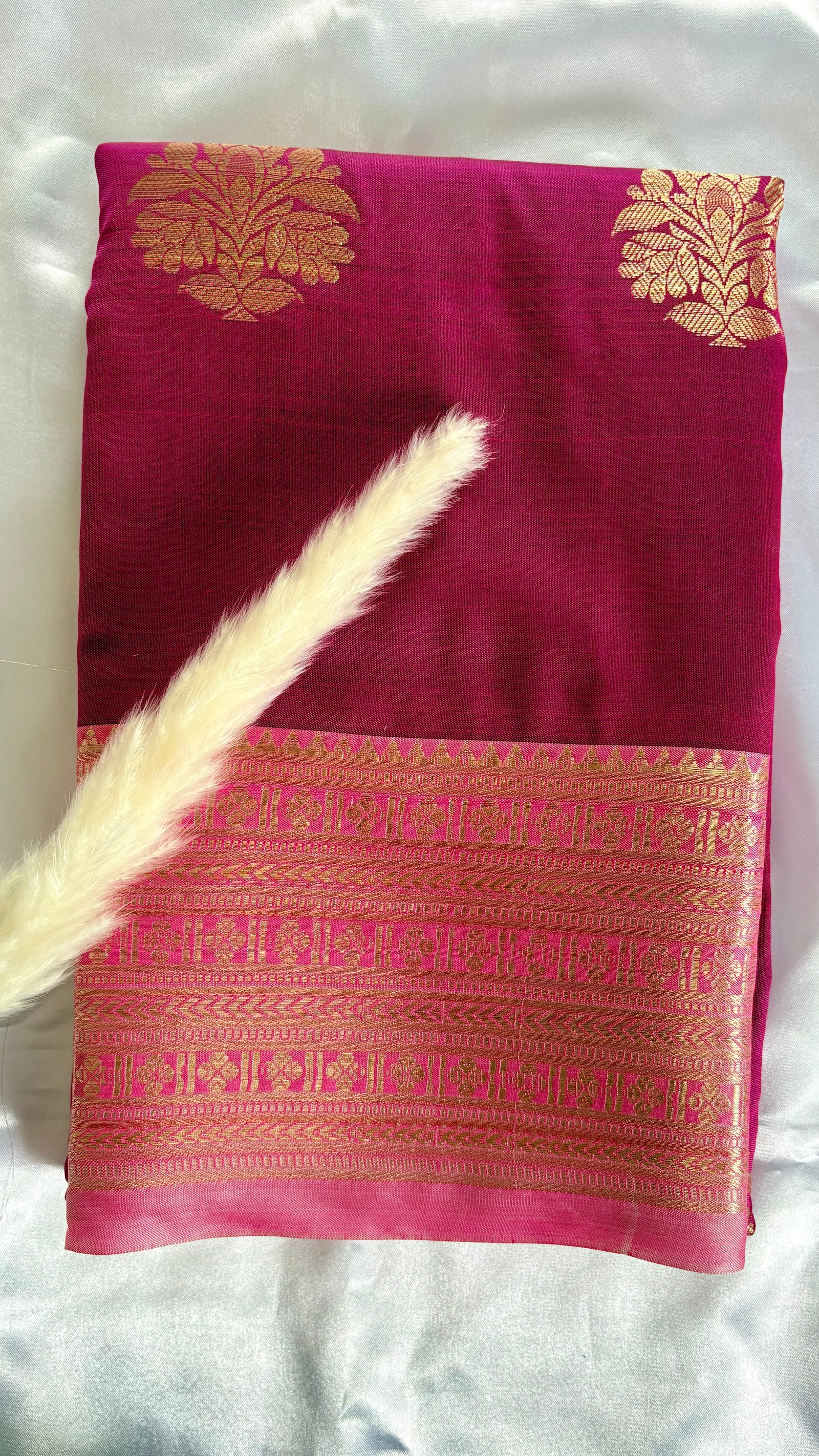 Maroon Kanchipuram soft silk saree adorned with traditional gold zari bootis and an intricate geometric patterned border  (Saree Code - S98)
