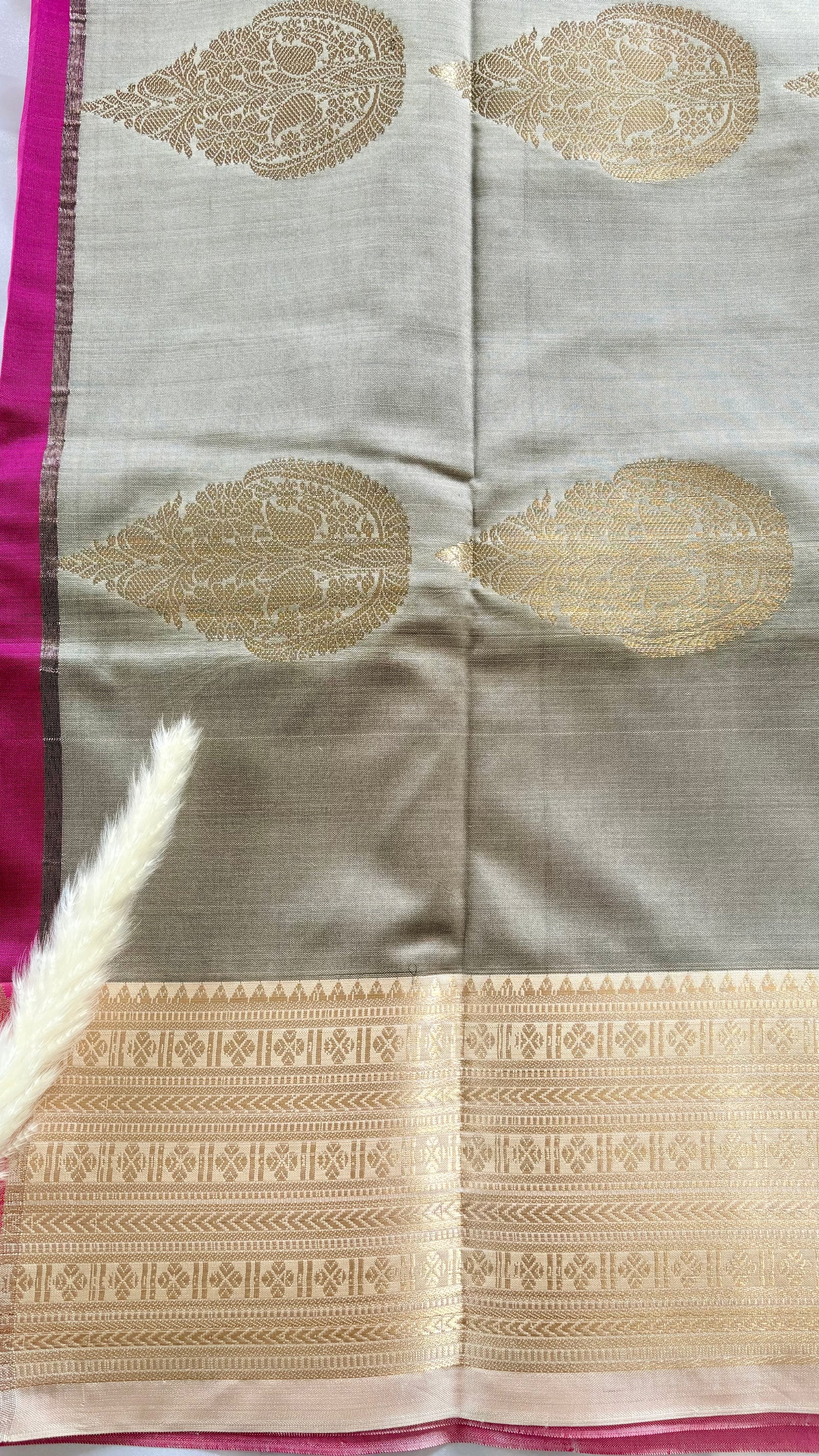 Maroon Kanchipuram soft silk saree adorned with traditional gold zari bootis and an intricate geometric patterned border  (Saree Code - S98)