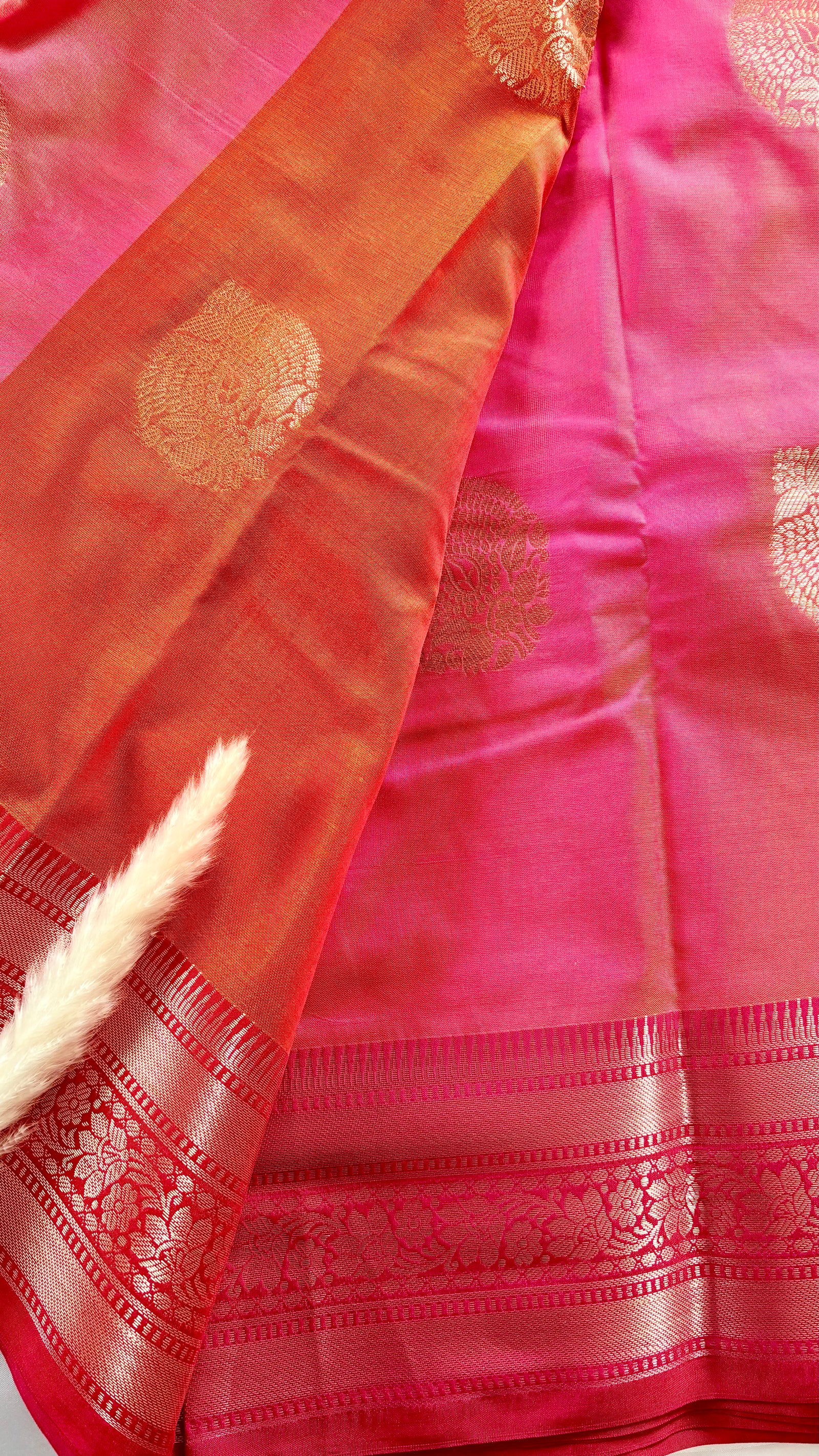 Orange Kanchipuram soft silk saree adorned with traditional gold zari bootis and pink border  (Saree Code - S99)