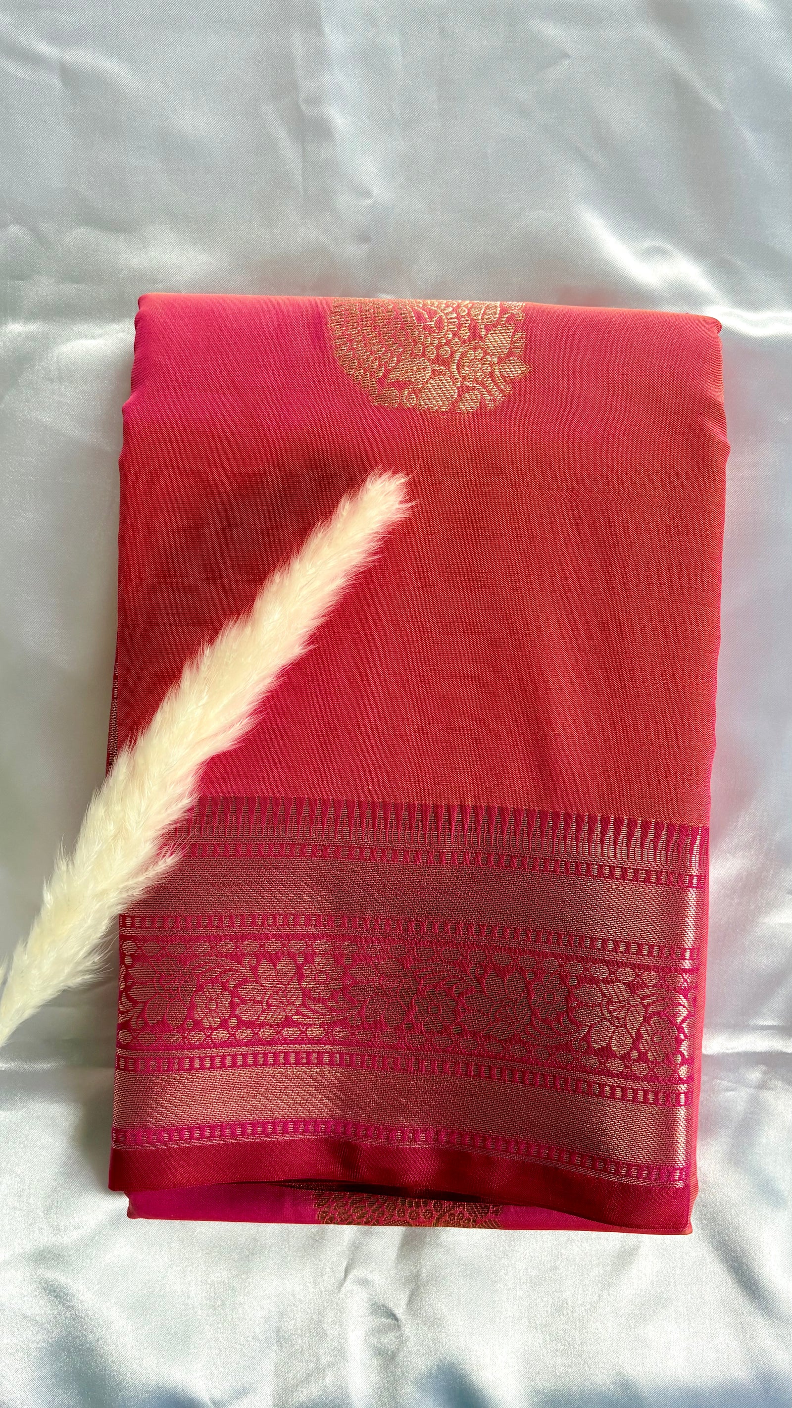 Orange Kanchipuram soft silk saree adorned with traditional gold zari bootis and pink border  (Saree Code - S99)