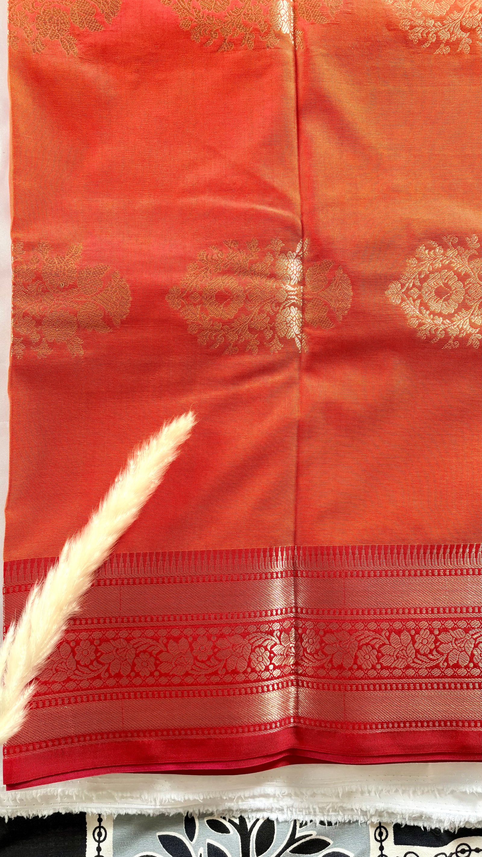 Orange Kanchipuram soft silk saree adorned with traditional gold zari bootis and pink border  (Saree Code - S99)